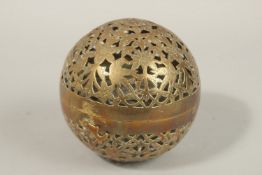 A FINE EARLY 19TH CENTURY MUGHAL NORTH INDIAN OPENWORKED BRASS HAND WARMER, with birds and flower