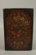 A LARGE 19TH CENTURY PERSIAN QAJAR LACQUERED BOOK COVER, 33cm x 22cm.