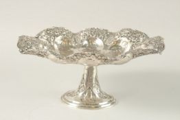 A PERSIAN ENGRAVED AND CHASED SOLID SILVER FOOTED CENTREPIECE, with detachable stand, the bowl