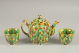 A CHINESE YELLOW GREEN AND BROWN GLAZED PORCELAIN TEAPOT WITH TWO TEACUPS, each with character