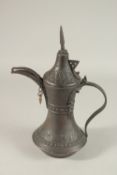 A 20TH CENTURY OMANI COFFEE POT, 33cm high.