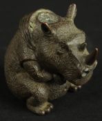 A BRONZE OKIMONO OF A RHINOCEROS.
