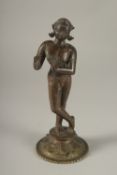 A RARE LARGE 16TH CENTURY OR EARLIER INDIAN BRONZE FIGURE OF FLUTING KRISHNA, (the base possibly