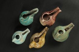 A COLLECTION OF FIVE 12TH-13TH CENTURY PERSIAN GLAZED POTTERY OIL LAMPS, (5).