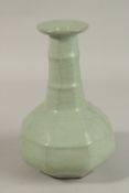 A CHINESE CRACKLE GLAZE CELADON BOTTLE VASE, 23.5cm high.