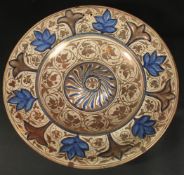 A LARGE 19TH CENTURY HISPANO MORESQUE COPPER LUSTRE CHARGER, 41cm diameter.