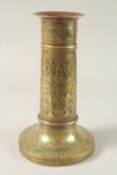 A FINE 19TH CENTURY PERSIAN BRASS CANDLESTICK WITH SILVER INLAYS, the body engraved with seated