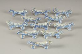 A COLLECTION OF CHINESE BLUE AND WHITE PORCELAIN BRUSH RESTS / CHOPSTICK RESTS, (qty).