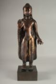 A LARGE COPPER BRONZE STANDING BUDDHA, mounted to a square form plinth, 61cm high overall.