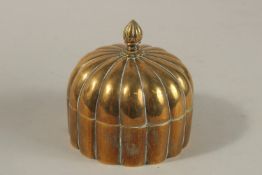 A 19TH CENTURY MUGHAL INDIAN DOMED BRASS PANDAN BOX, 12cm high.