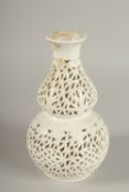 A CHINESE PIERCED PORCELAIN DOUBLE GOURD VASE, 20.5cm high.