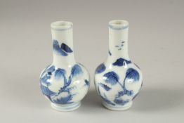 A MINIATURE PAIR OF CHINESE BLUE AND WHITE PORCELAIN VASES, 8.5cm high.