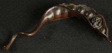 A BRONZE OKIMONO OF A MANGETOUT.