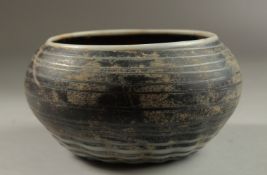 A RARE POSSIBLY 14TH-15TH CENTURY SYRIAN MAMLUK MARVERED GLASS BOWL, 14.5cm diameter.