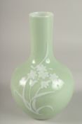 A CHINESE CELADON GLAZE PORCELAIN FLORAL BOTTLE VASE, the base with character mark, 26cm high.