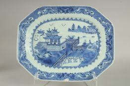 A LARGE 18TH-19TH CENTURY BLUE AND WHITE PORCELAIN SERVING DISH, painted with a landscape scene,