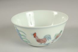 A FINE CHINESE DOUCAI PORCELAIN CHICKEN CUP, the base with character mark, 8.5cm diameter.