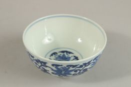 A CHINESE BLUE AND WHITE PORCELAIN BOWL, with six-character mark, 12cm diameter.