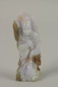 A CHINESE CARVED JADE FIGURE OF GUANYIN, 12cm high.