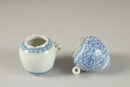 TWO CHINESE BLUE AND WHITE PORCELAIN BIRD FEEDERS.