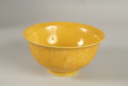 A CHINESE YELLOW GLAZE PORCELAIN BOWL, with incised decoration, base with character mark, 15cm