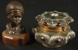 AN AFRICAN BRONZE BUST TOGETHER WITH A DECORATIVE GLASS BOX, (2).
