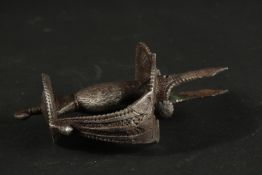 A 17TH CENTURY STEEL TULWAR HILT.