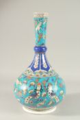 A LARGE TURKISH IZNIK GLAZED POTTERY VASE, painted with harpies and animals, 40cm high.