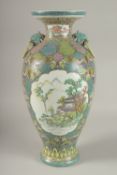 A LARGE CHINESE POLYCHROME PORCELAIN TWIN HANDLE VASE, painted with panels of figures in outdoor
