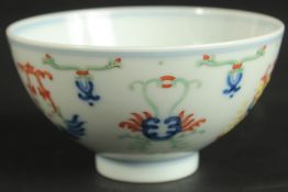 A CHINESE DOUCAI PORCELAIN CUP, with six-character mark, 10cm diameter.