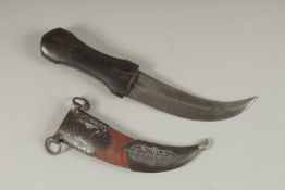 A 19TH CENTURY OTTOMAN HORN HILTED DAGGER, with silver inlaid steel mounted scabbard, 28cm long.