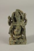 A FINELY CARVED 19TH-20TH CENTURY SOUTH INDIAN GREEN STONE GANESH, 13cm high.