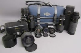 Collection of camera lenses includes Sigma mirror tele-photo multi coated 1:8, Canon zoom lens FD