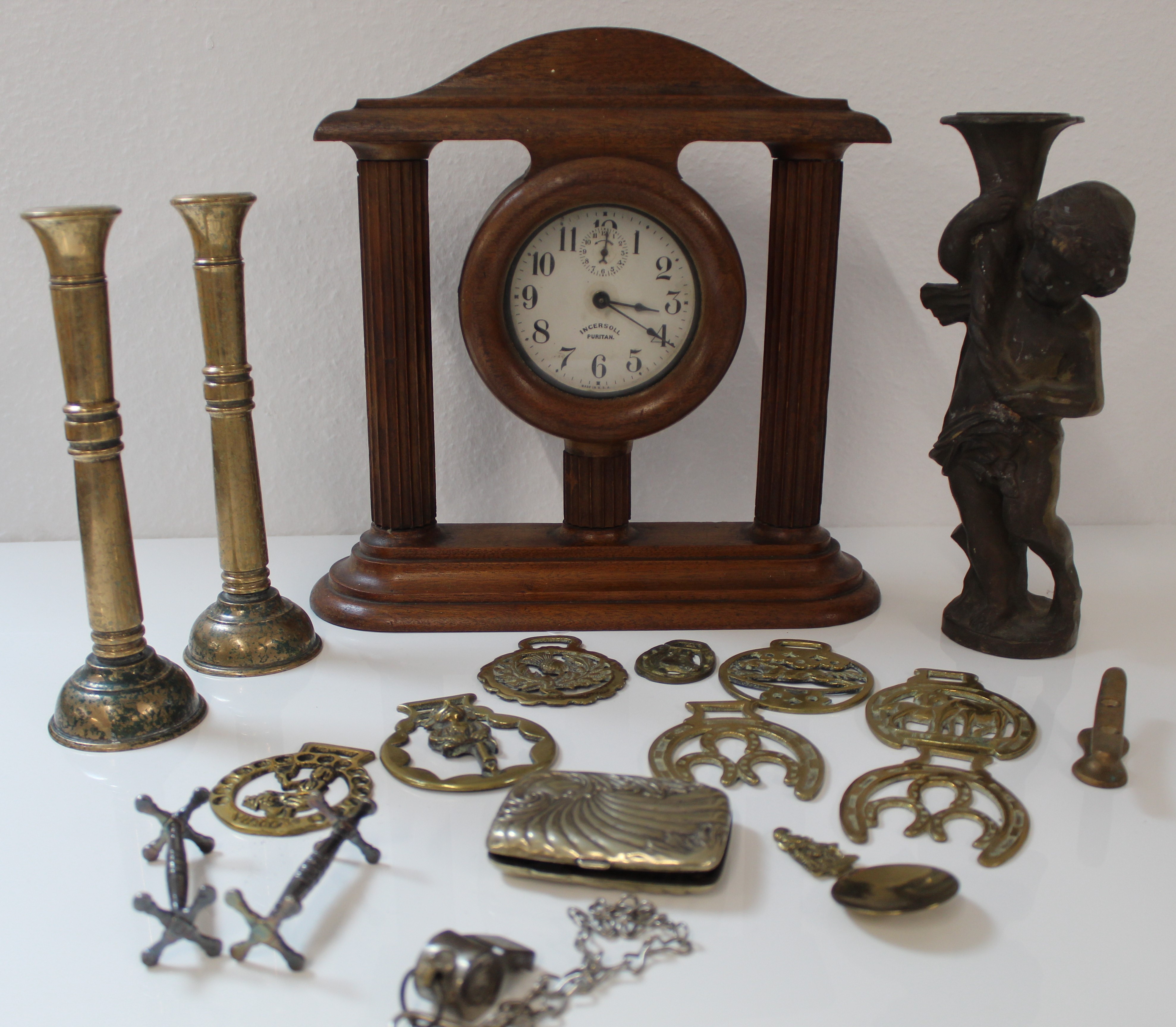 Decorative wooden clock and a collection of brassware