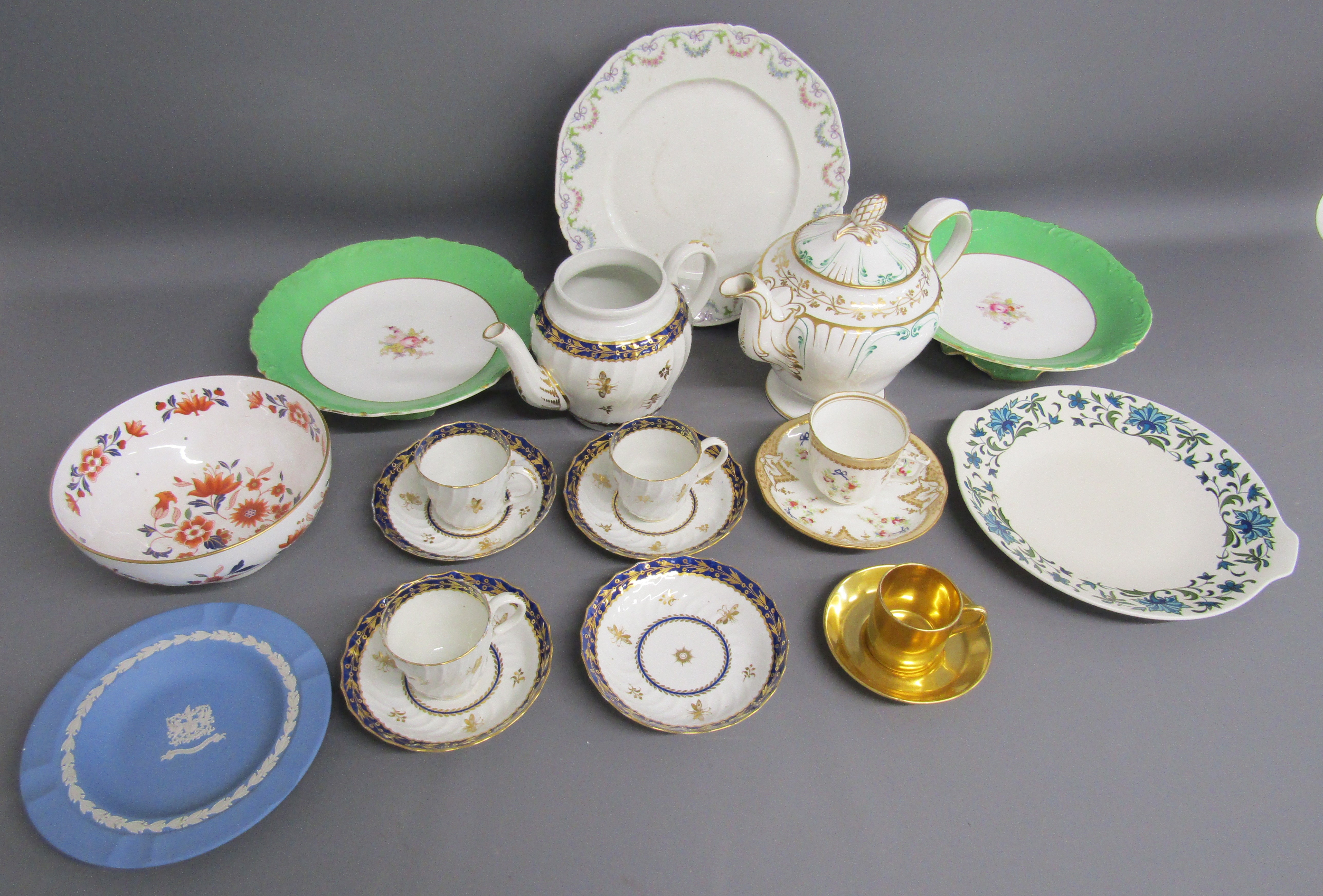 Collection of ceramics includes Wedgwood, blue and gold teacups and saucers with matching teapot