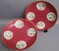 2 Chinese plates cherry red with 4 white panels containing floral, furniture and vase designs, white