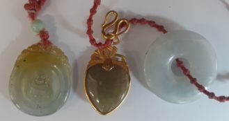 Tested as minimum 18ct gold mounted jade heart pendant & 2 further jade pendants