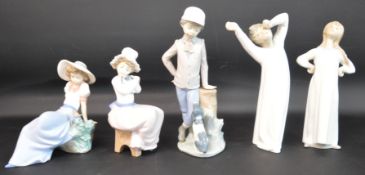 Two Lladro figurines - boy & girl in nightgown (boy has repaired arm) & 3 Nao figurines - girl