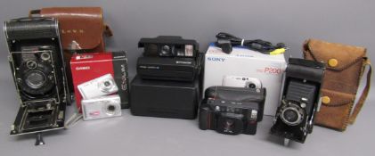 Collection of cameras - Zeiss Ikon, Casio Exilim, Polaroid image system SE, Minolta AF-DL, Ensign