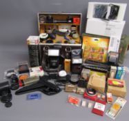 Collection of camera accessories includes Cokin filters, Vivitar zoom thyristor 285 flash, Canon
