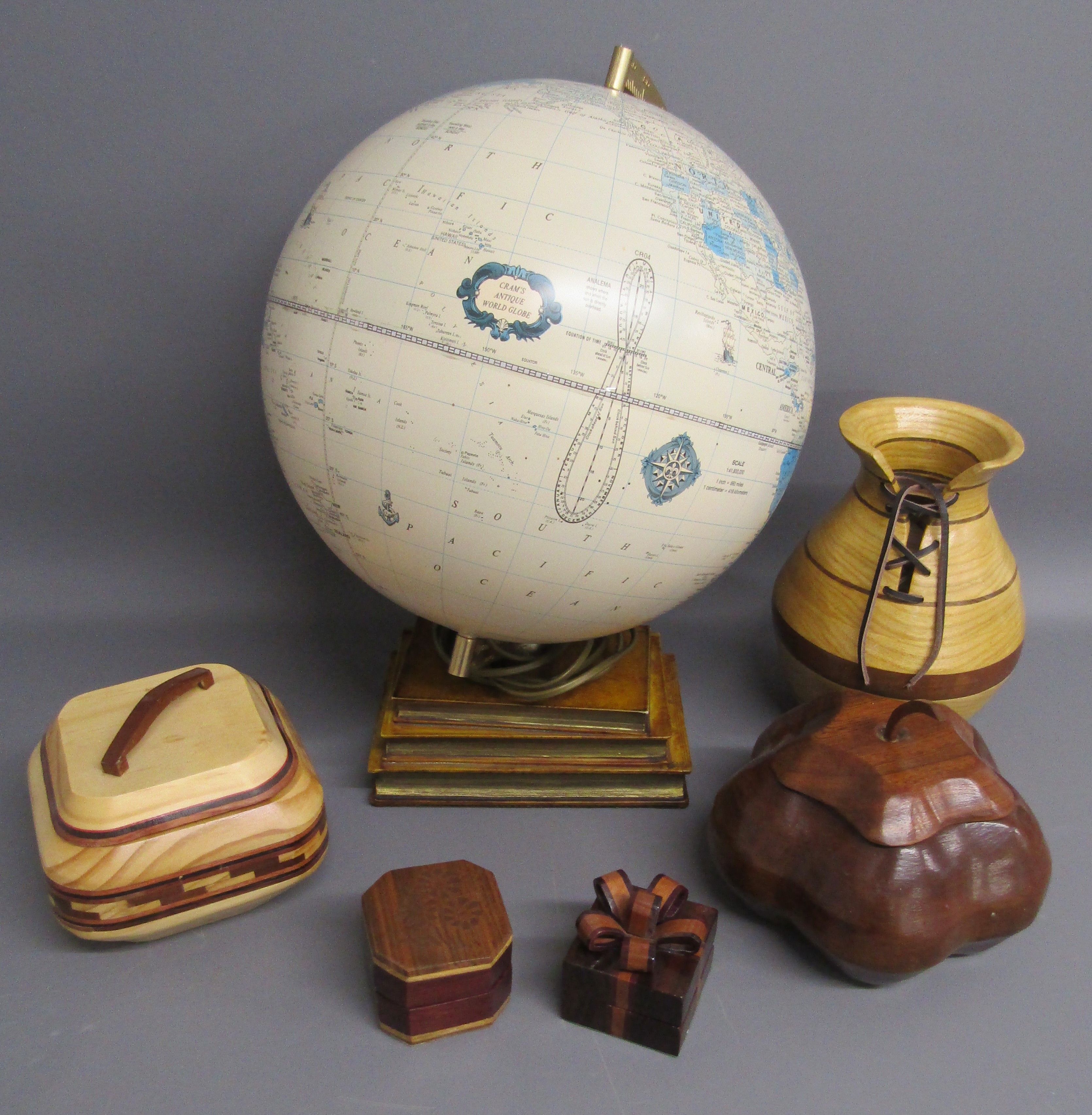 Cram's antique world globe light , lidded wooden boxes and wooden vase with lace up design
