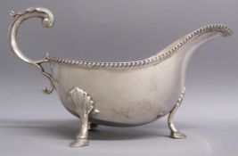 William Hutton & Sons 1938 Sheffield silver gravy boat with gadroon edge and scroll handle - total