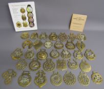 Collection of 33 horse brasses, The Collector's Anthology book and All about horse brasses booklet -