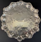 George III silver card tray on 3 feet 8.9ozt London 1760 makers mark RR, 18cm dia.