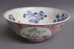 Chinese bowl with flower design with four white panels having trees and flower designs, white inside