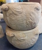 Pair of concrete decorative pots with scroll handles