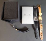 CHRISTIAN DIOR -- Malice watch D78-159 gold plated on leather strap with trademark stirrup detail,