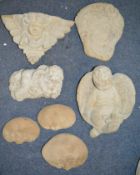 Decorative garden items:- small cherub on a bed of grapes, Cherub's face, lady's face, sleeping