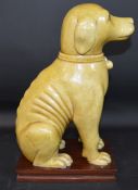 Chinese seated dog on later rosewood stand 27.5cm