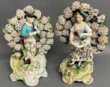 Two bocage back Staffordshire figures of the gardener & his wife (not a pair) with evidence of